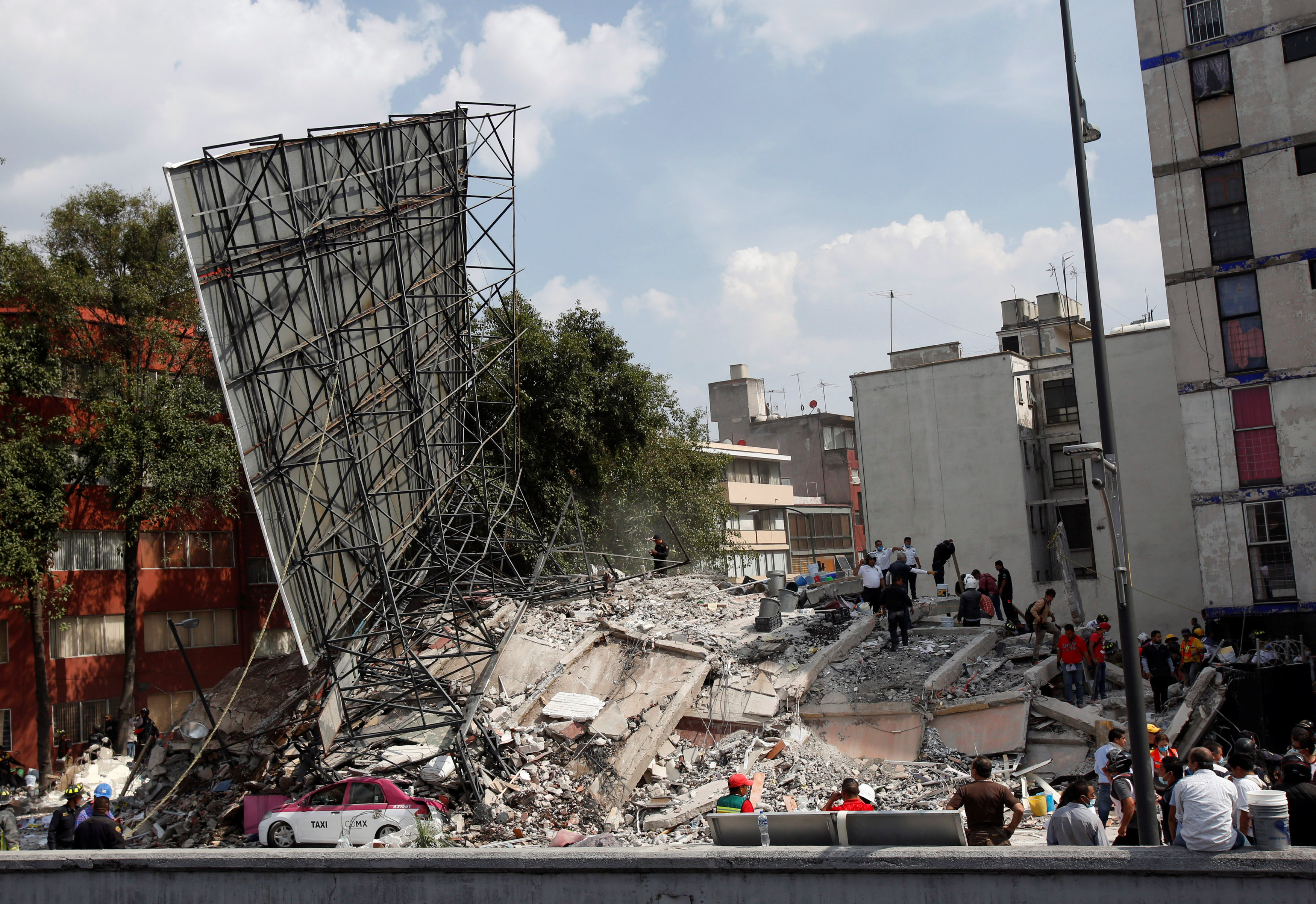 A collapsed building is seen after an earthquake in Mexico City, Mexico September 19, 2017. REUTERS/Ginnette Riquelme