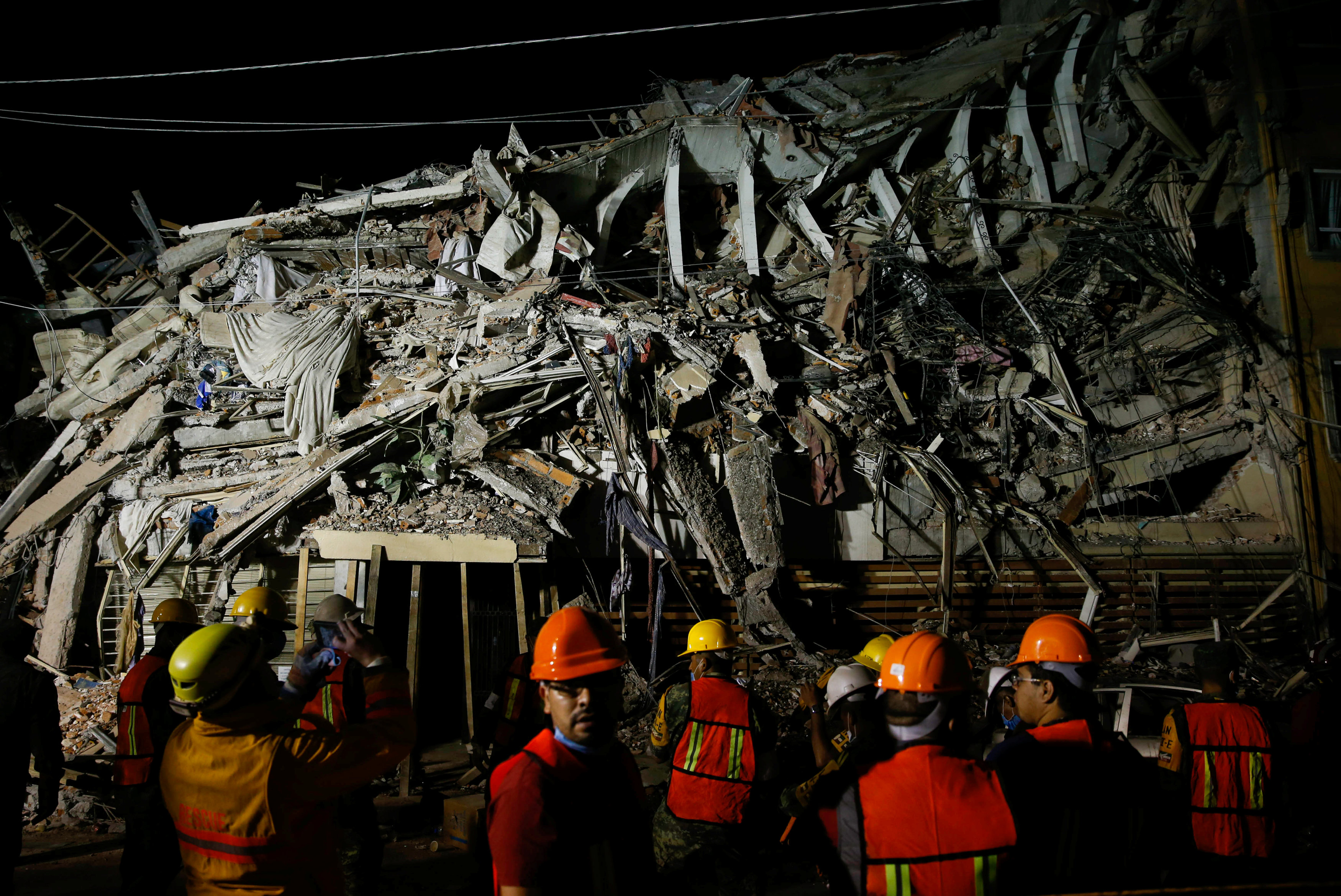 REFILE - REMOVING TYPO - Rescuers work at the site of a collapsed building after an earthquake in Mexico City, Mexico September 20, 2017. REUTERS/Henry Romero